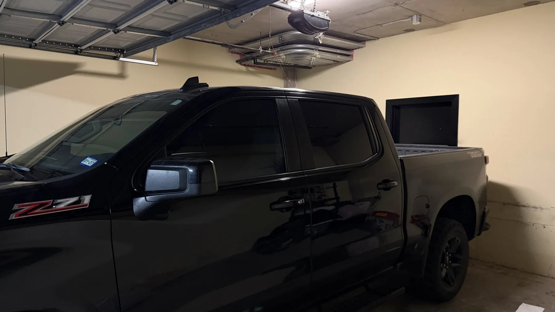 Side view showing 5 percent front-door and rear-door tint on a Chevrolet Silverado